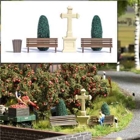 Park benches, trees (thujas) and stone cross