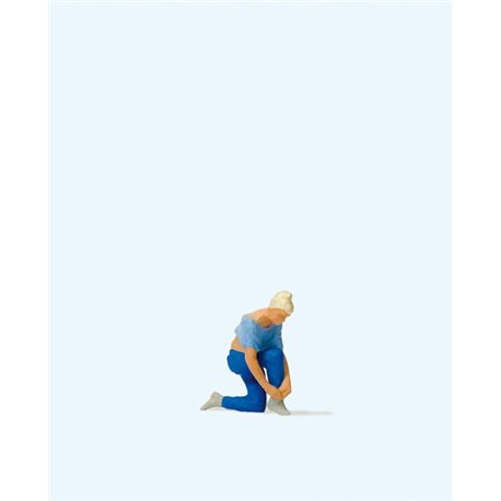 Woman Tying Her Shoes